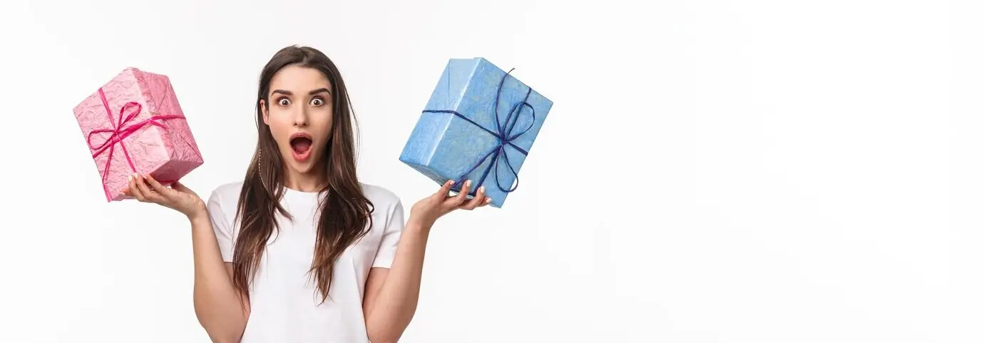 Holiday celebrations and presents concept: portrait of an excited, astounded, amazed young girl receiv